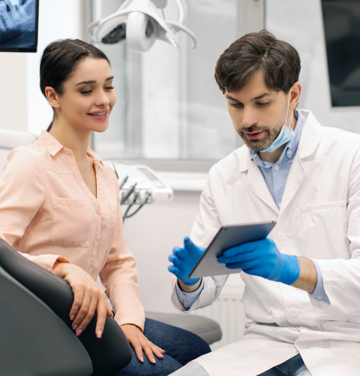 Dentist discussing treatment with patient